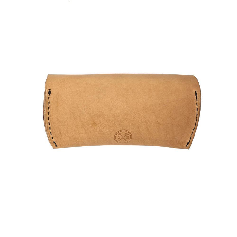 Tan leather sunglasses case with contrast stitching and stamped logo emblem