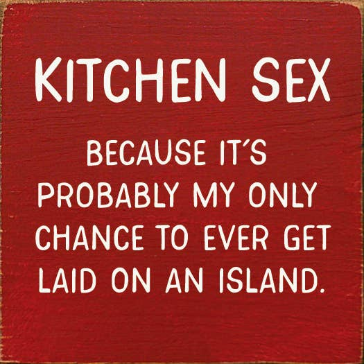 Red novelty sign with white text, “Kitchen Sex” and humorous message