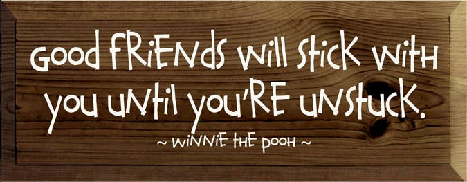 Wooden wall sign with white quote: “Good friends will stick with you...”