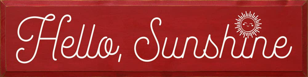 Red banner sign with white cursive 'Hello, Sunshine' text and a sun icon