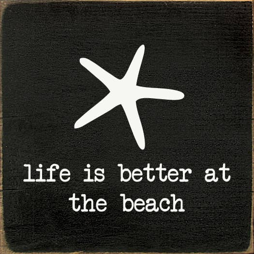 Beach wood sign with starfish graphic and text: "Life is better at the beach"