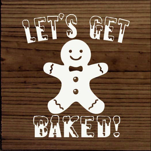 White gingerbread man cutout on walnut wooden sign with “LET’S GET BAKED!” lettering