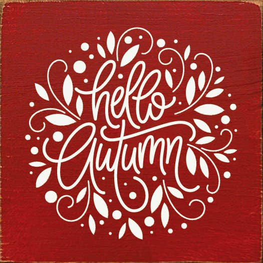 Decorative wall sign with red square background and white Hello Autumn script