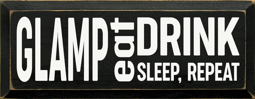 Decorative black sign with white 'GLAMP' and 'DRINK SLEEP, REPEAT' text