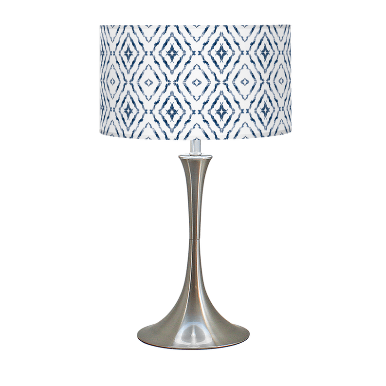 Table lamp with blue-and-white geometric drum shade and gold-toned hourglass base