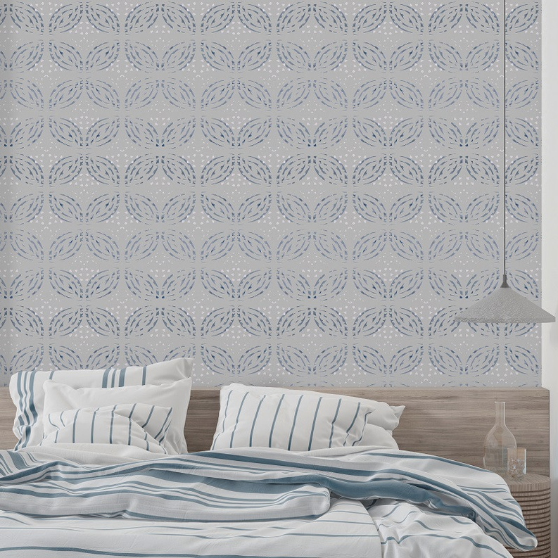 Peel-and-stick wallpaper with blue repeating medallion pattern on wall