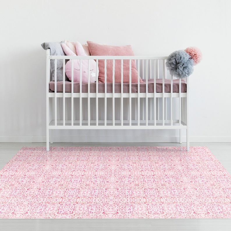 Pink floral indoor/outdoor rug laid flat on the floor