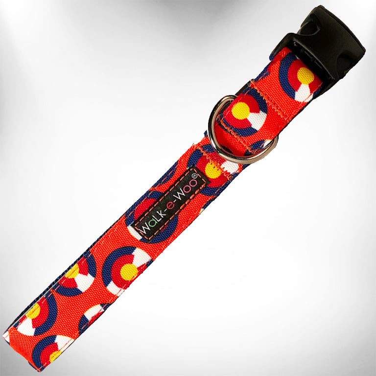 Orange patterned dog collar with black buckle and metal D-ring