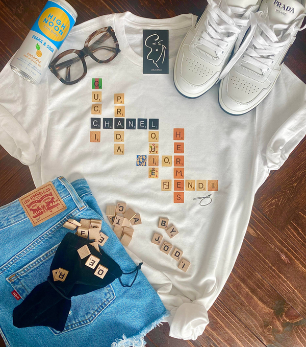 White graphic T-shirt with GAME and NIGHT letter art