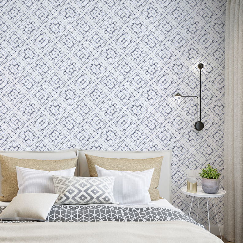 Peel-and-stick wallpaper with blue-and-white medallion geometric pattern on a light background