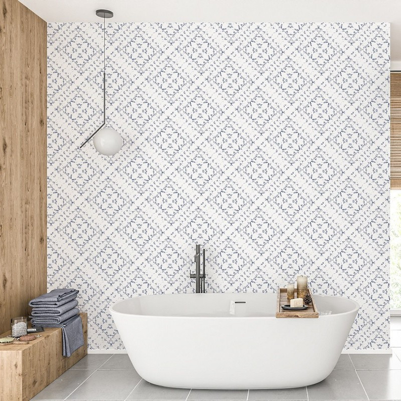 Peel-and-stick wallpaper with blue-and-white medallion geometric pattern across a bathroom wall
