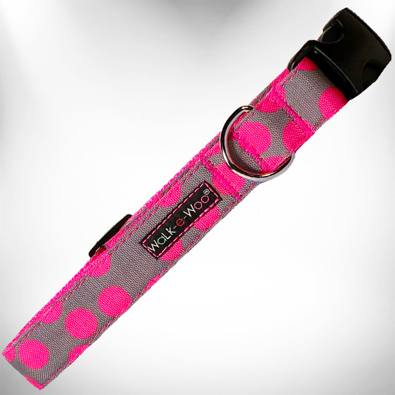 Neon pink polka dot dog collar with black buckle and D-ring