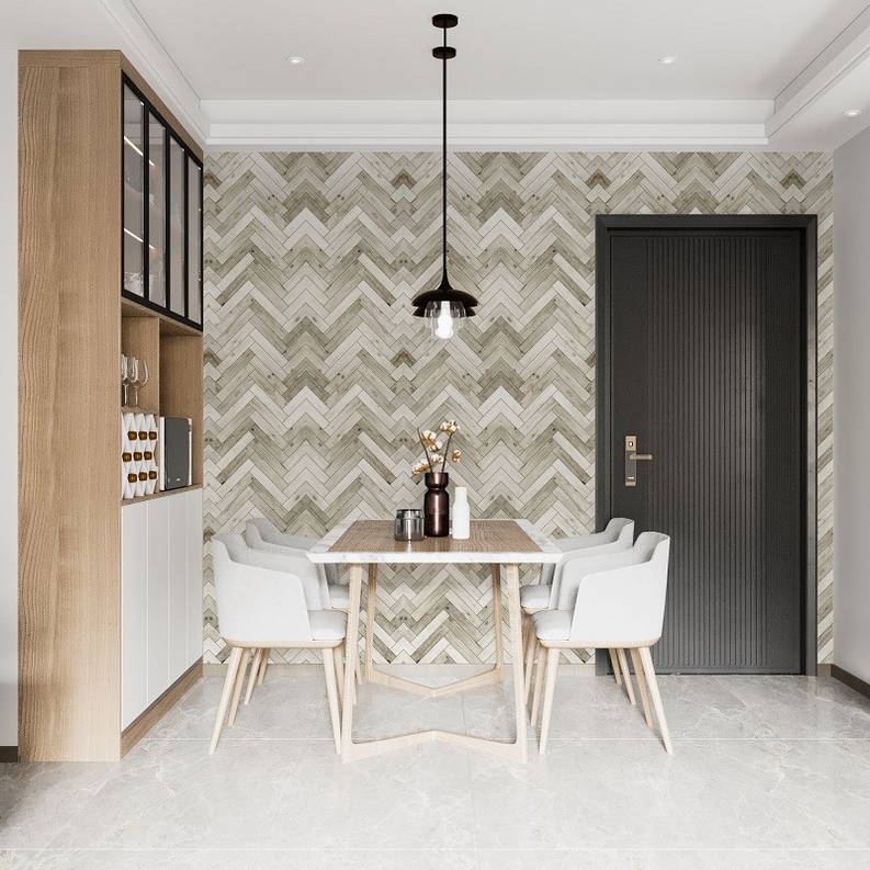 Chevron herringbone peel-and-stick wallpaper in white and gray on interior accent wall
