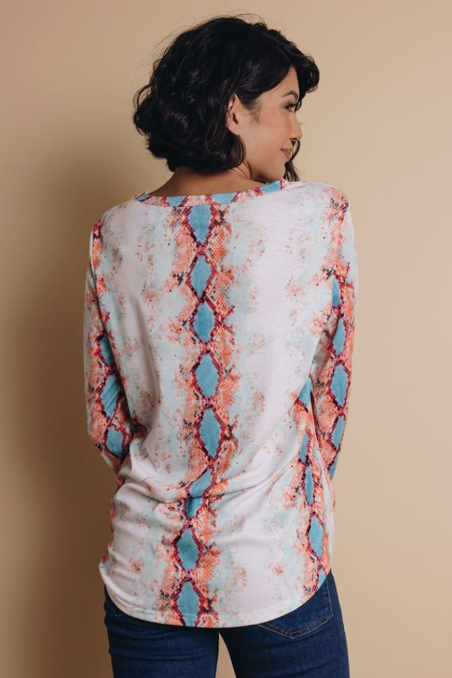 White long-sleeve top showing back with red-blue snakeskin pattern