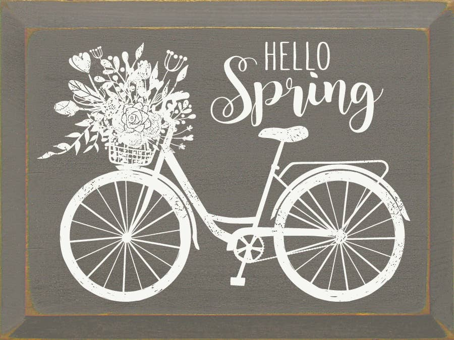 Hello Spring chalkboard-style sign with bicycle and floral lettering on dark gray