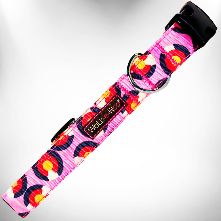 Pink patterned dog collar with metal D-ring and black buckle end