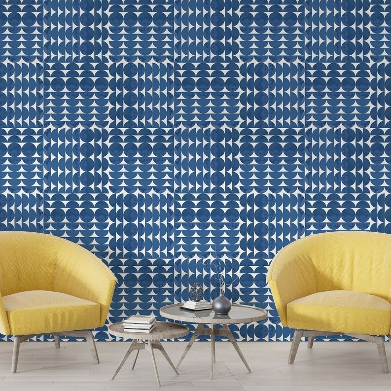 Blue geometric peel-and-stick wallpaper with scalloped circle pattern on wall