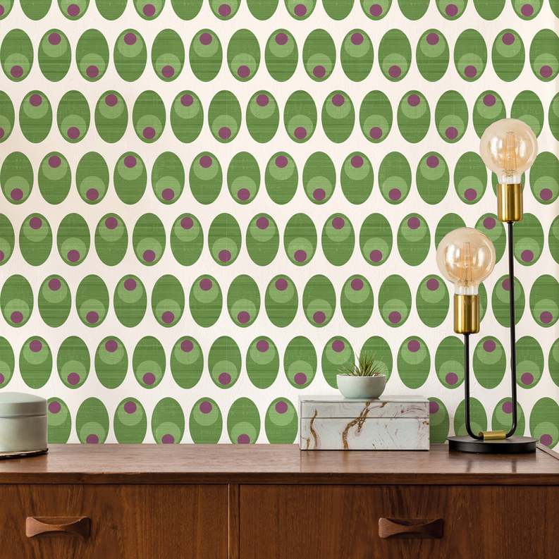 Green olive oval pattern peel-and-stick wallpaper covering a room wall