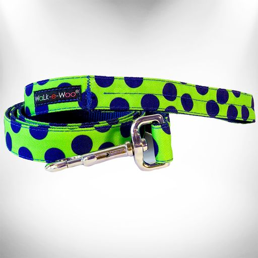 Neon green dog lead with navy polka dots and shiny metal clip