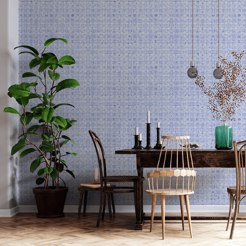 Blue floral peel-and-stick wallpaper on wall with subtle repeating print.