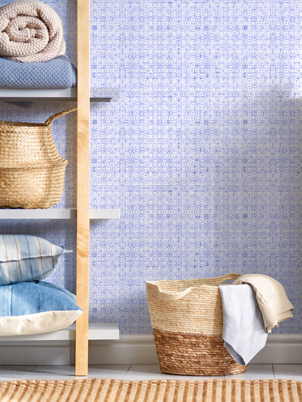 Blue floral peel-and-stick wallpaper panel with small repeating pattern.