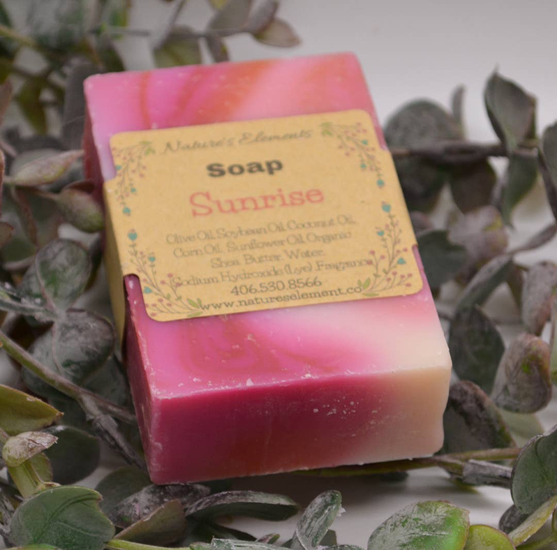 Pink handcrafted soap bar with gold label reading Soap Sunrise