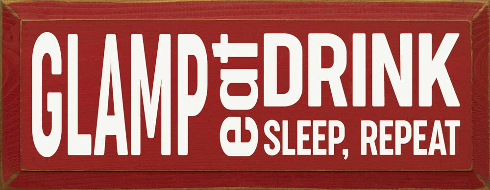Red rectangular wall sign with white GLAMP and DRINK SLEEP, REPEAT text