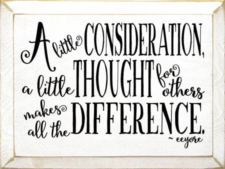 Wood wall sign with quote: 'A little consideration makes a difference'.