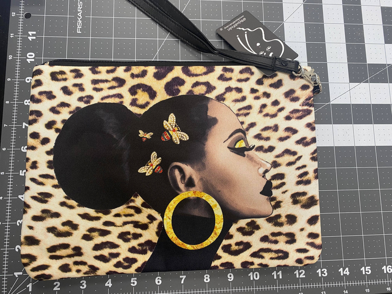 Leopard queen bee pouch with side profile graphic, gold hoop print, and zipper strap