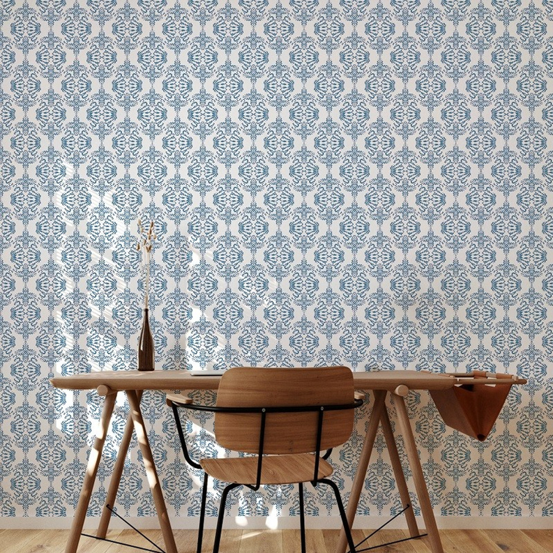 Peel-and-stick wallpaper with blue and white repeating damask pattern