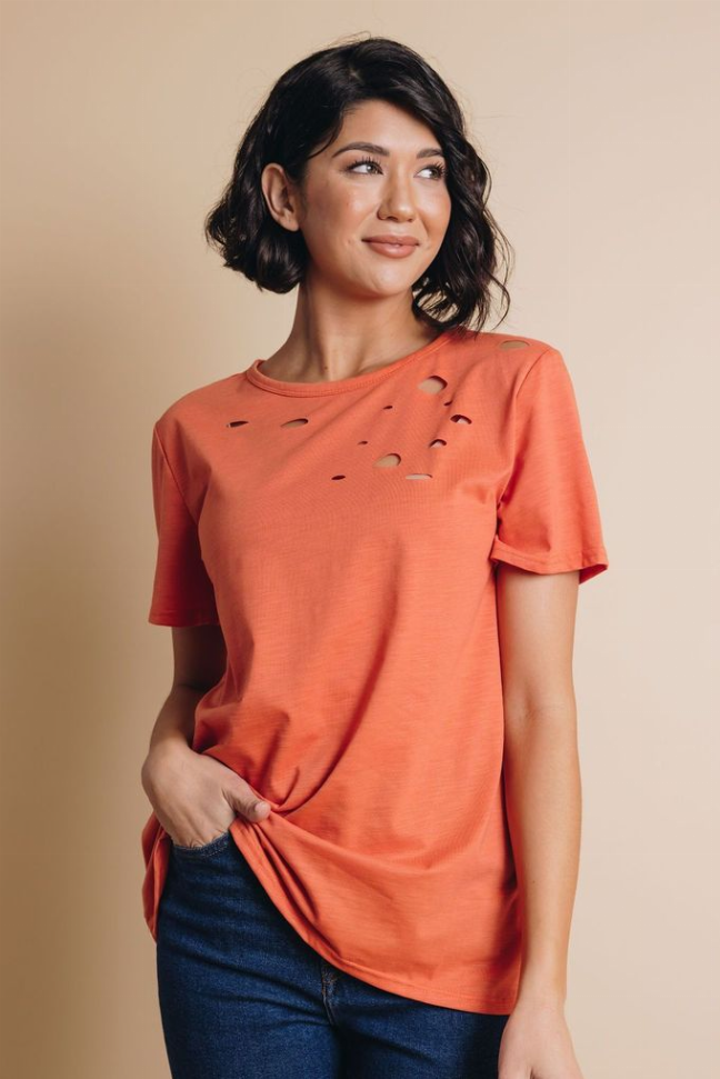 Coral crew neck short-sleeve T-shirt with distressed hole details on the front