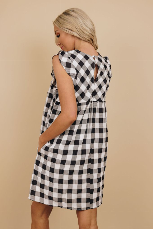 Black-and-white plaid ruffle dress, sleeveless with back tie, back side view