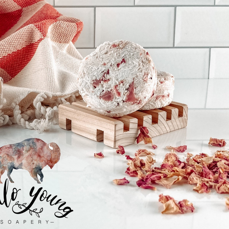 Chamomile shampoo bar, off-white with visible pink and red dried petals
