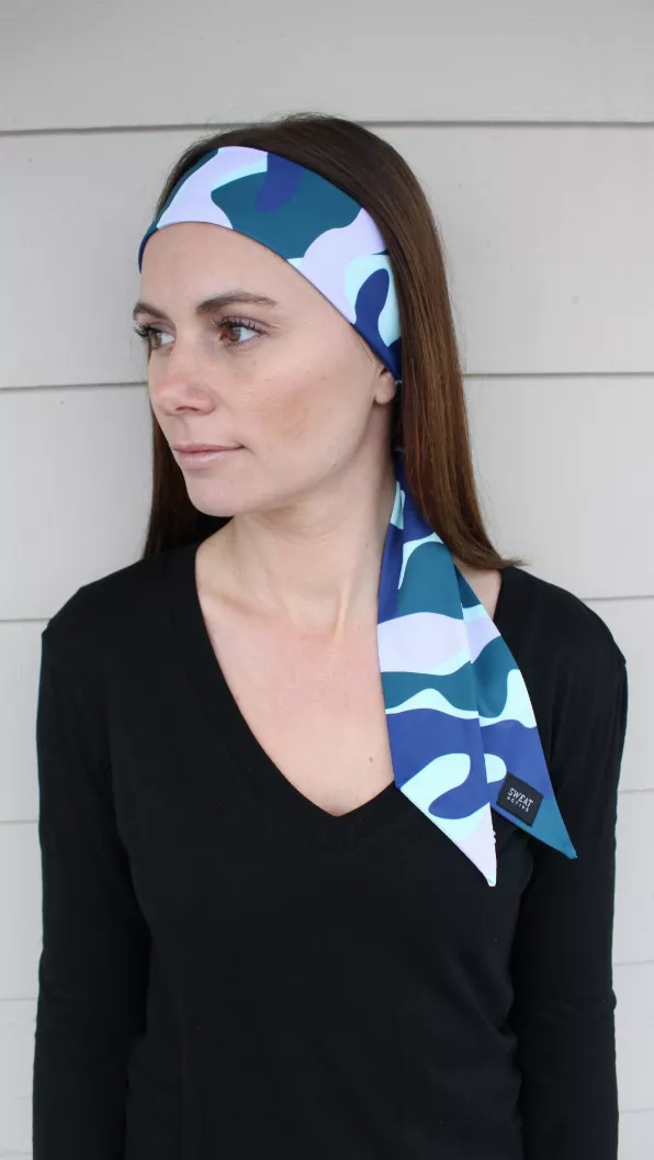 Sport headtie worn to the side, navy and teal wave camo with side knot
