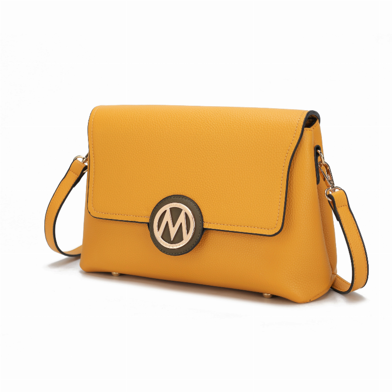 Mustard yellow crossbody bag with front flap and silver-tone hardware, side view