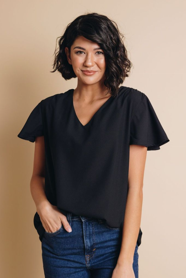 Black V-neck short-sleeve top with relaxed bodice and flared sleeves