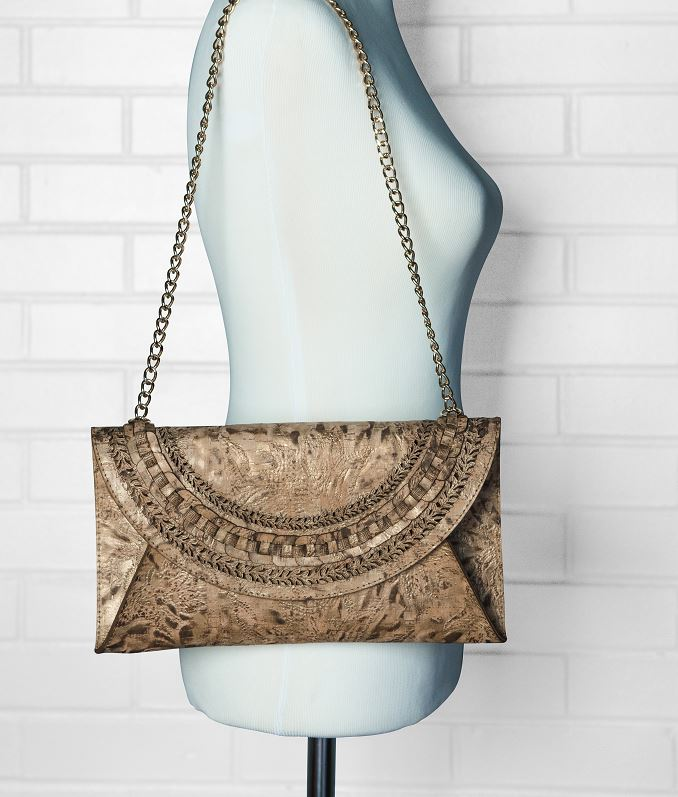 Natural cork handbag clutch with curved braided flap and linked chain handles
