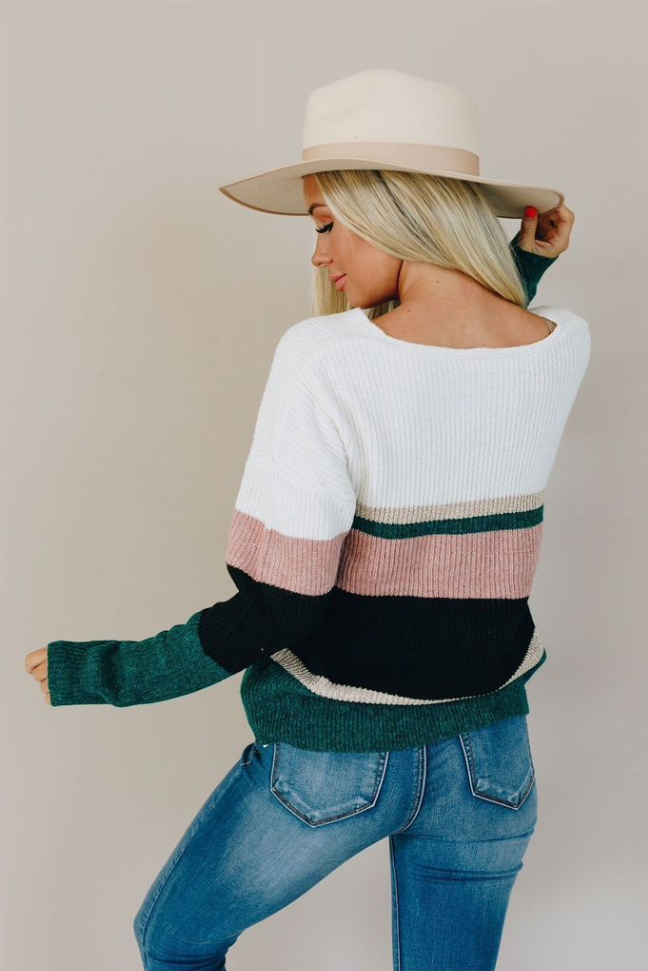 Candy striped knit sweater, back view with white knit and pink/dark green/black stripes