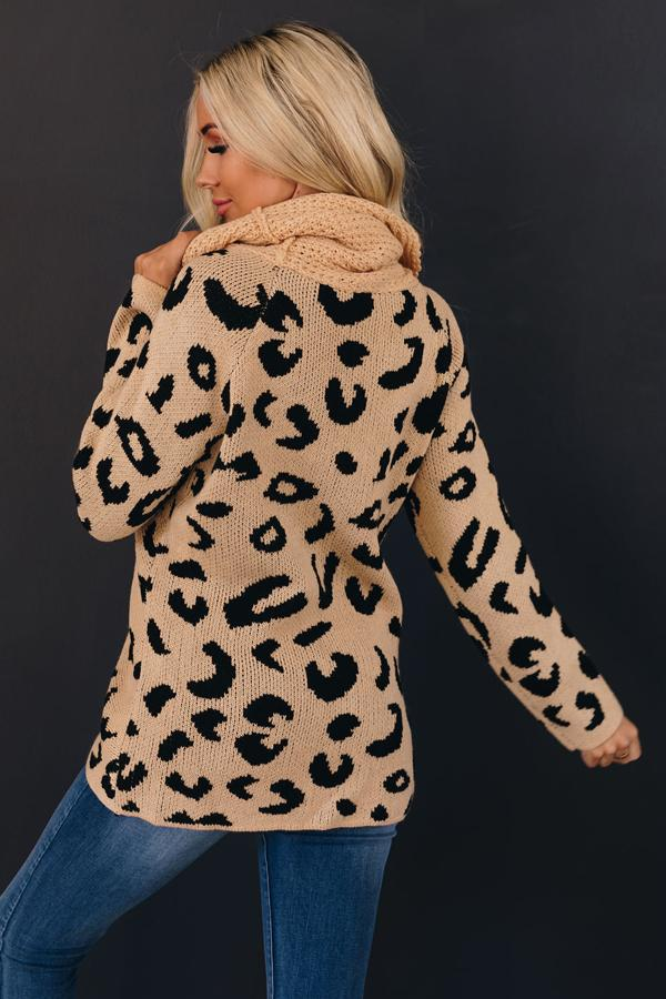 Leopard knit sweater with tan cowl neck, long sleeves, leopard back print