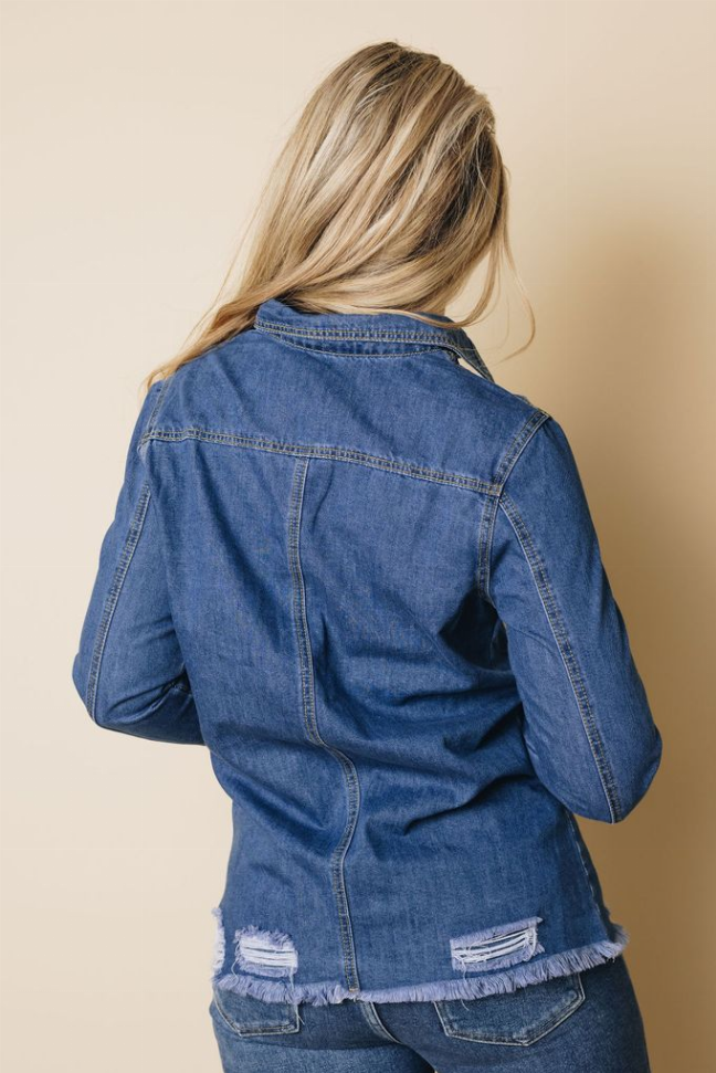 Women’s distressed blue denim jacket back view, button-front, panel seams, frayed lower edge
