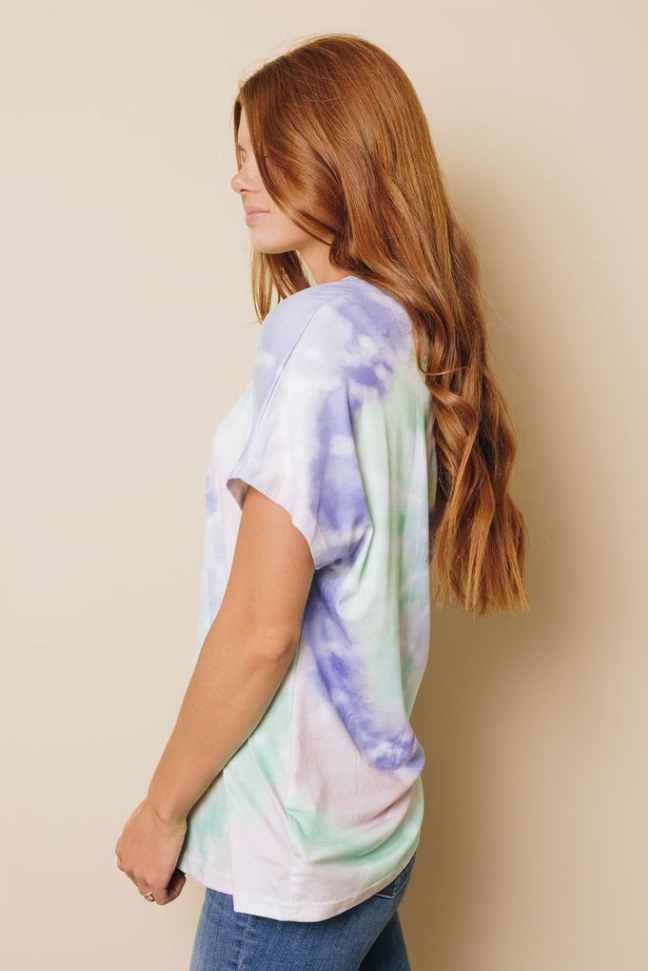 Pastel tie-dye T-shirt, side profile; purple swirls with mint and white
