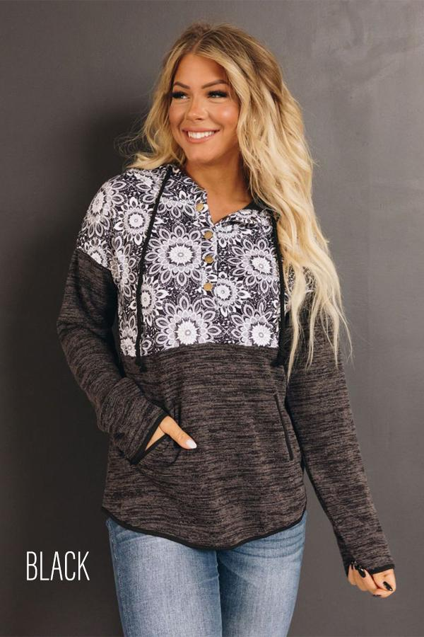 Dark charcoal tribal-panel hoodie with kangaroo pocket and hood