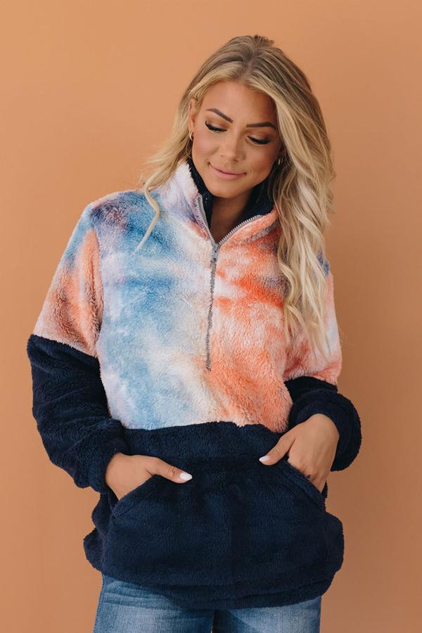 Tie-dye fuzzy pullover with half-zip and black kangaroo pocket, front view