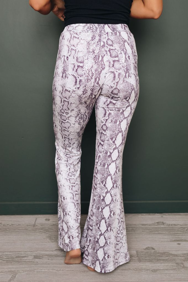 Purple snakeskin-print wide-leg pants with flared legs