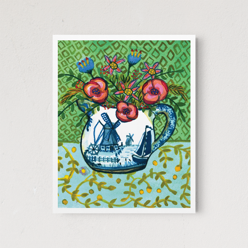 Square framed wall art with floral bouquet and blue windmill motif on green background