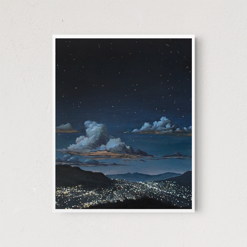 Framed night landscape art print with starry sky and city lights along the hills