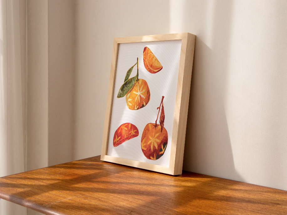 Wooden easel-framed orange and star-anise still-life artwork with slices and leaves