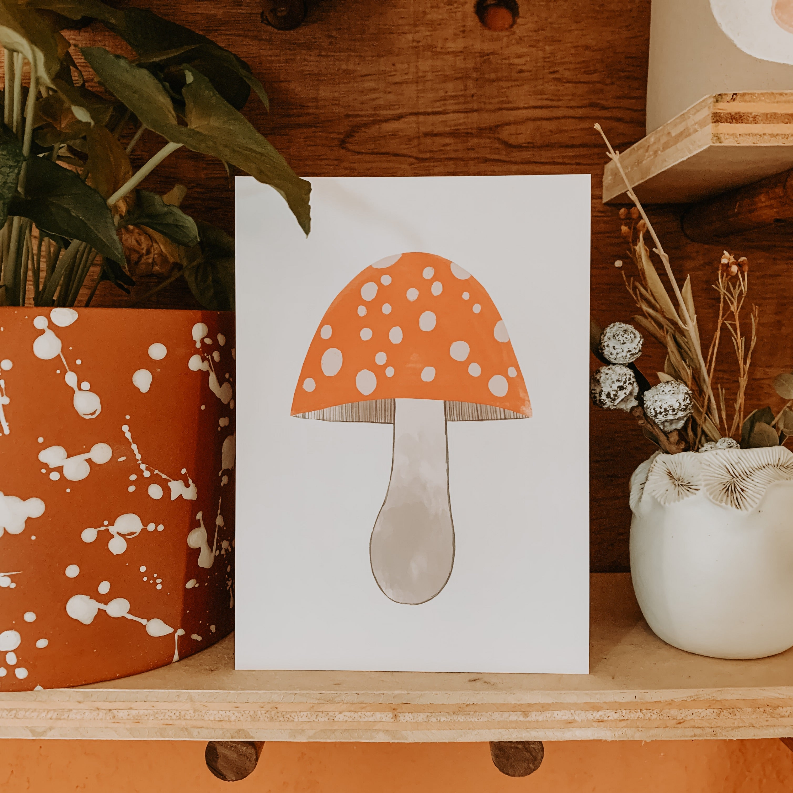 Mushroom art card with orange cap covered in white spots and a gray stem