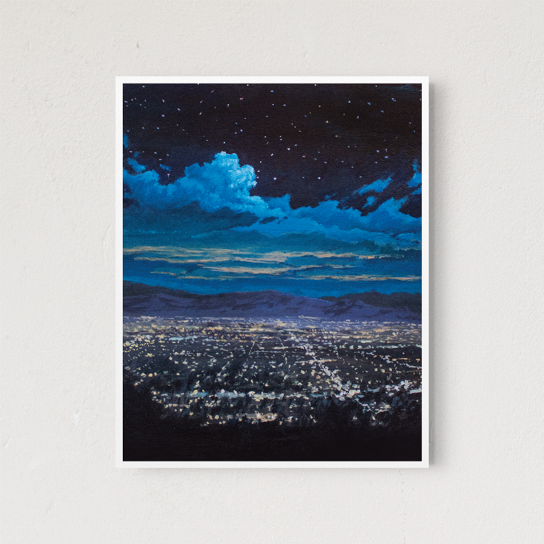 Framed night cityscape wall art print with white mat and dark starry sky