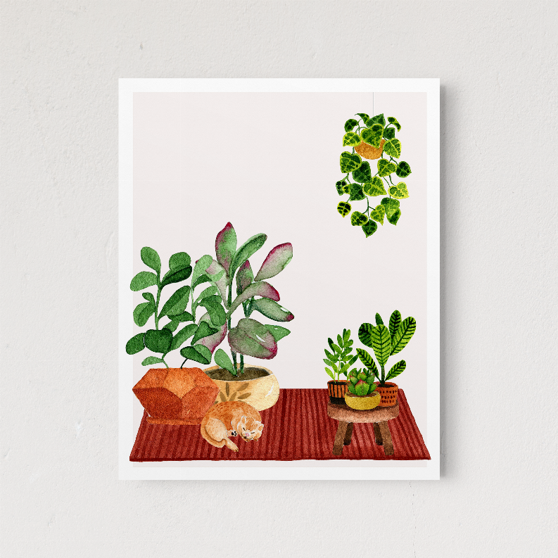 Framed botanical print with three potted plant clusters on a wooden table